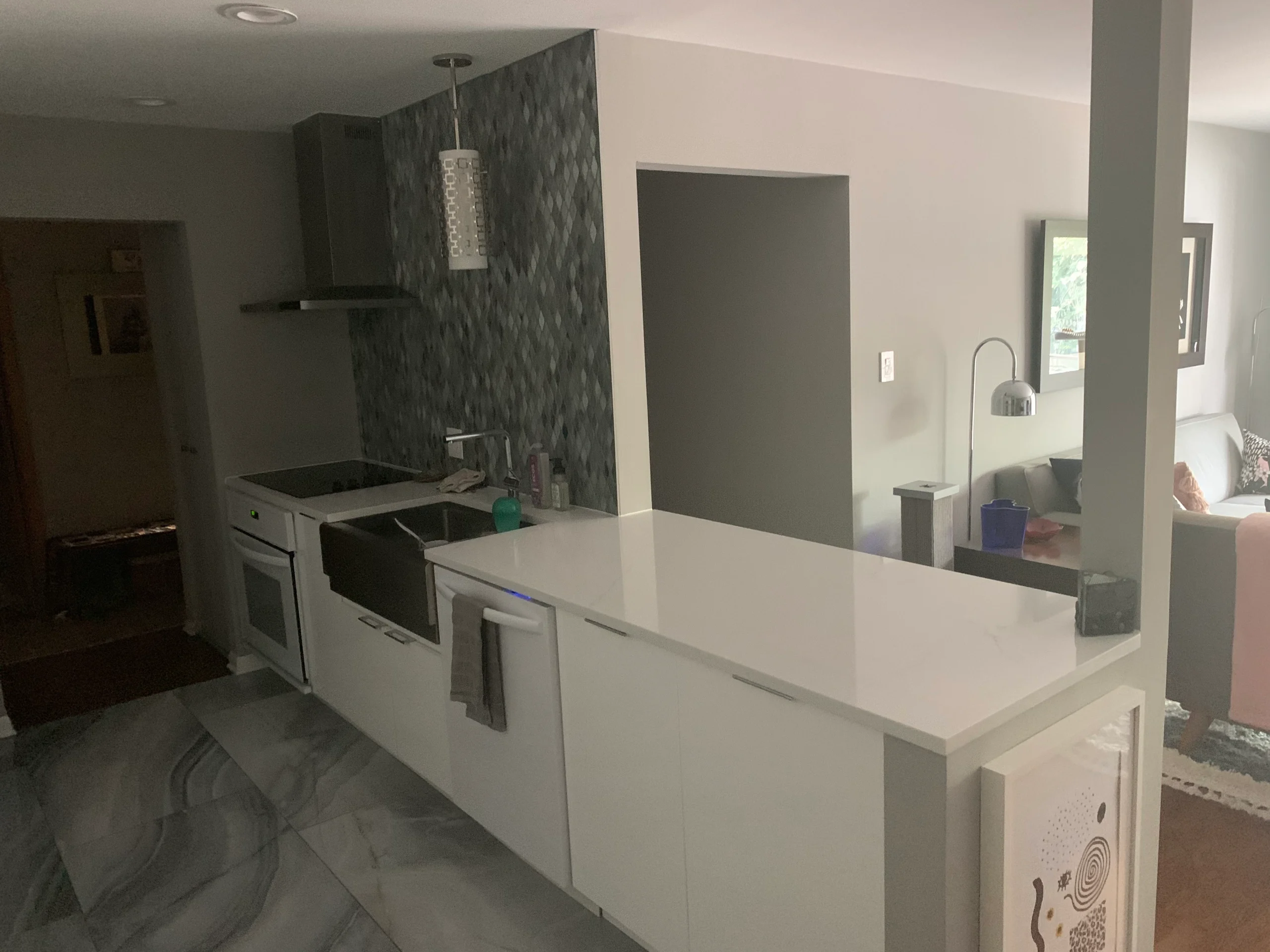 High-end kitchen transformation in Lakeview, Chicago with gold fixtures and a marble island.