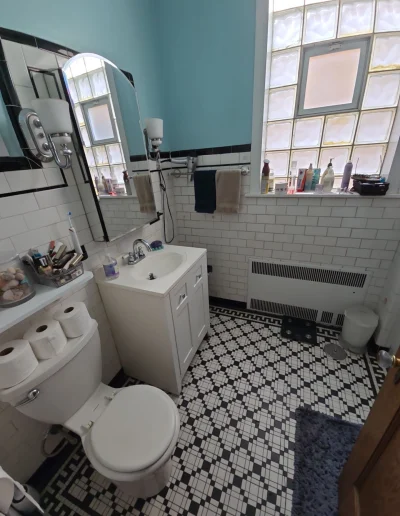 Upgraded bathroom with sleek fixtures and neutral color palette